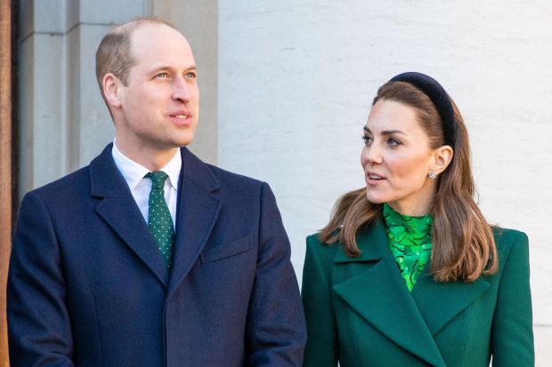 a man and a woman are standing next to each other