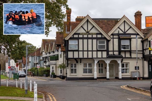 a group of people in a boat next to the manor hotel