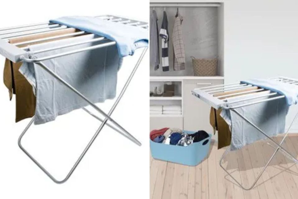 a clothes drying rack is sitting on top of a wooden floor next to a closet .