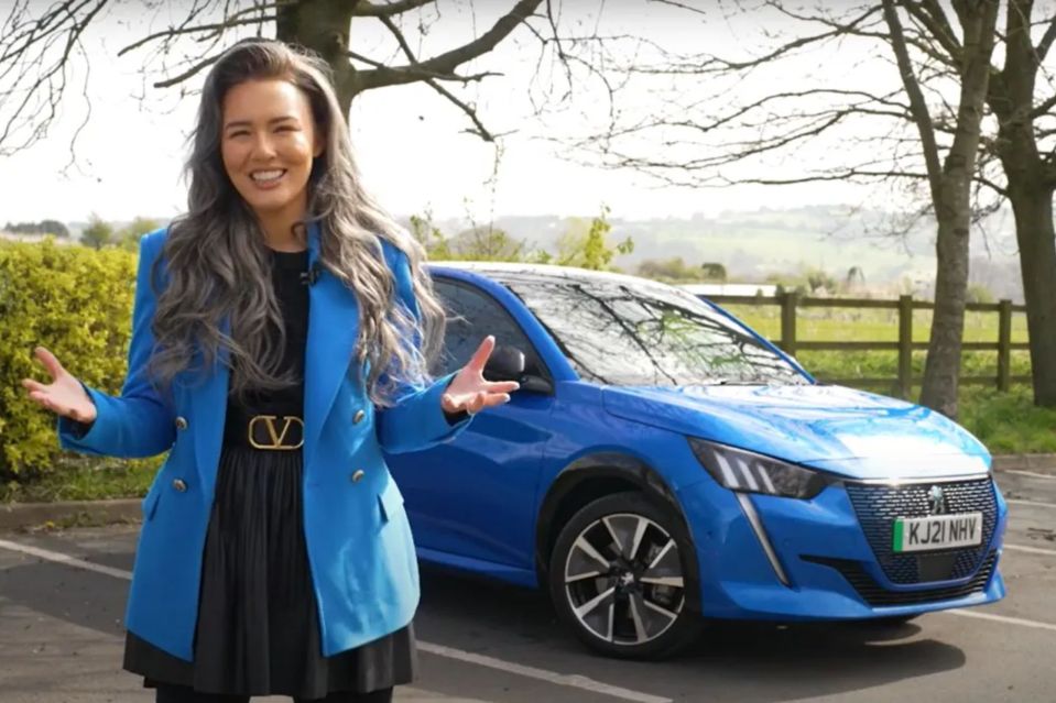 Abigayle presenting motoring tips and tricks, standing next to a blue car.