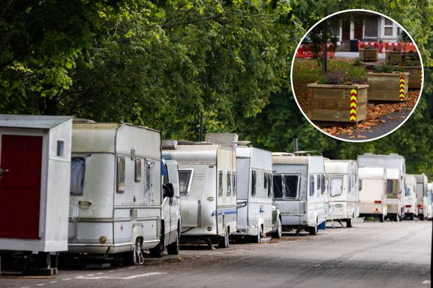 a row of caravans are parked on the side of the road