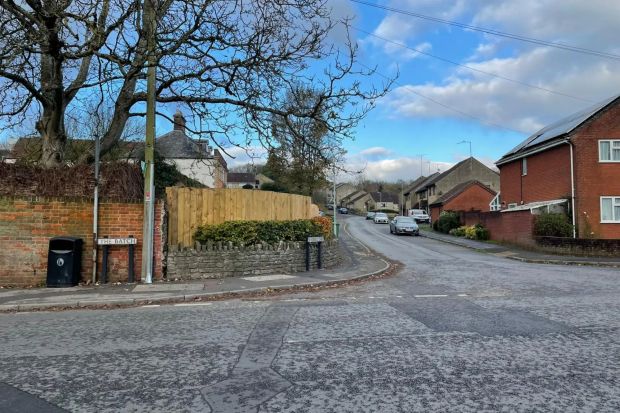 a street with a sign that says ' the brook ' on it