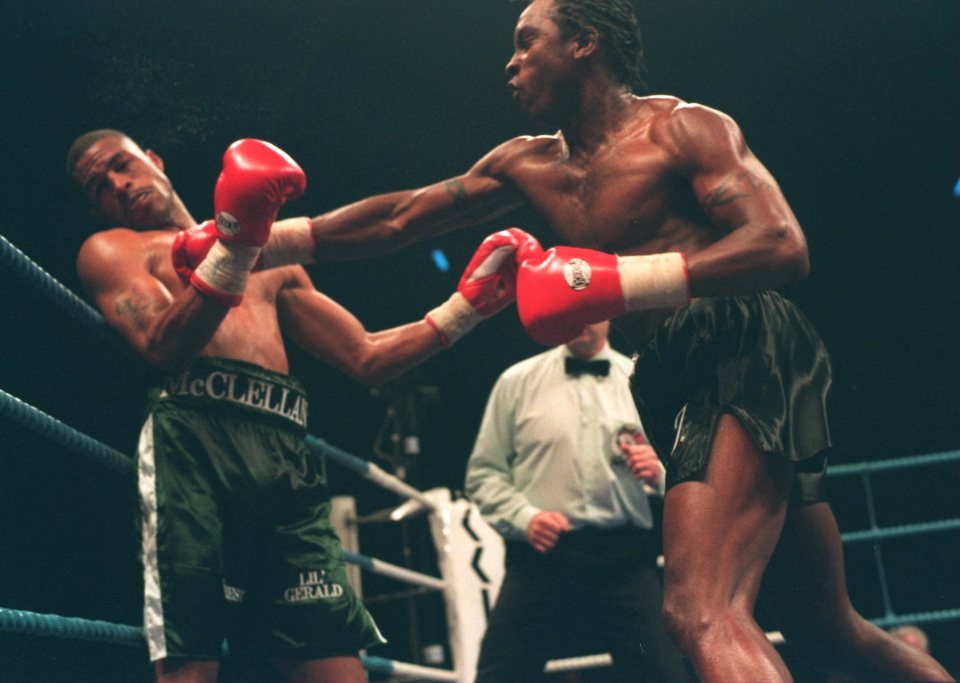 a boxer wearing green shorts with the word gerald on them