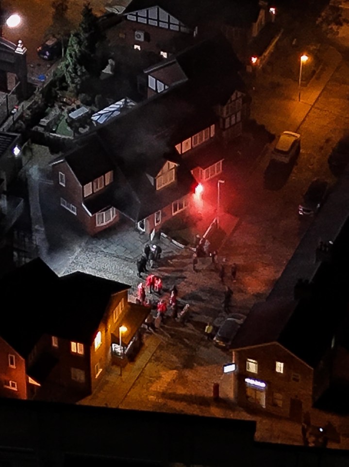 an aerial view of a residential area at night