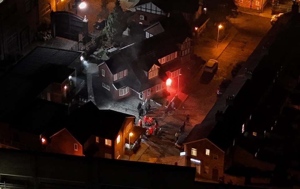 an aerial view of a residential area at night