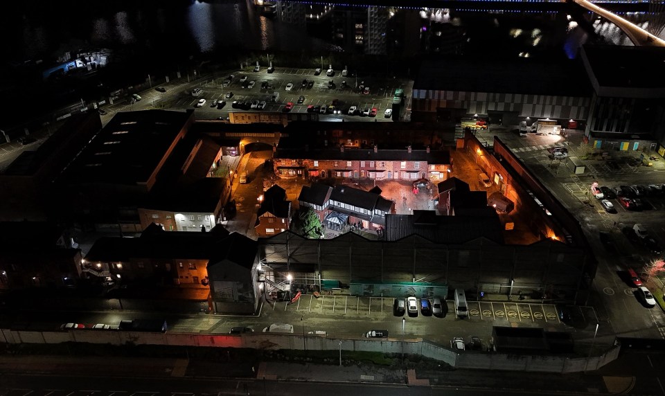 an aerial view of a parking lot at night