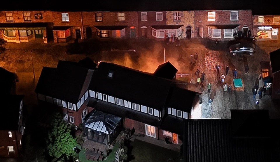 an aerial view of a residential area at night