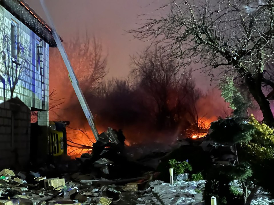 A fire burns after the Boeing 737 crashed near an airport in the Lithuanian capital