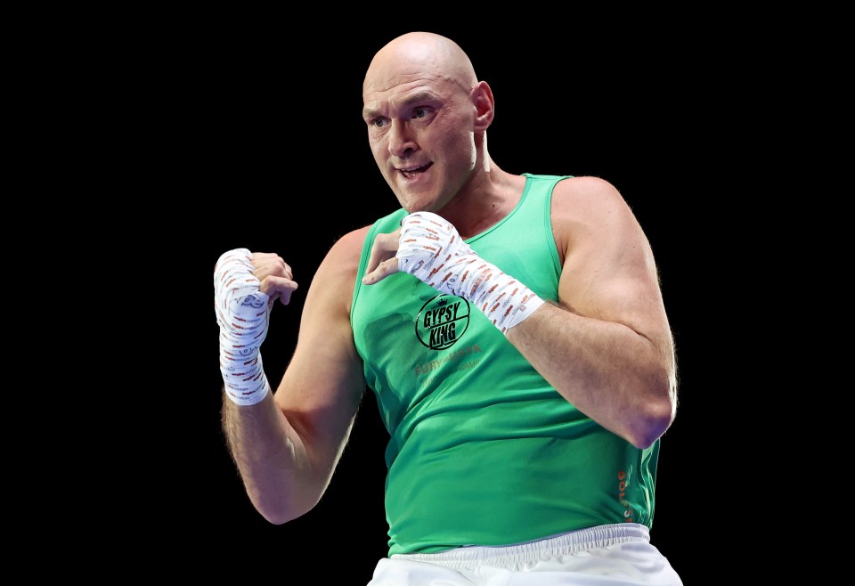 a boxer wearing a green tank top that says gypsy army