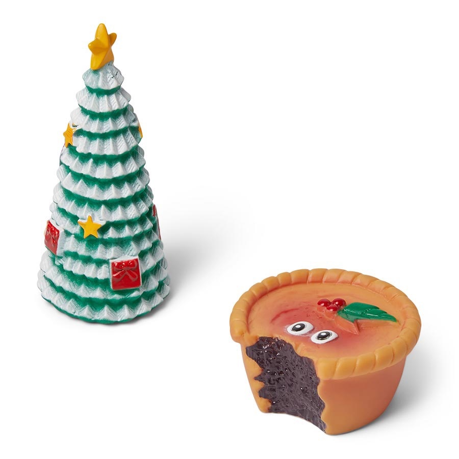 a christmas tree next to a cupcake with googly eyes