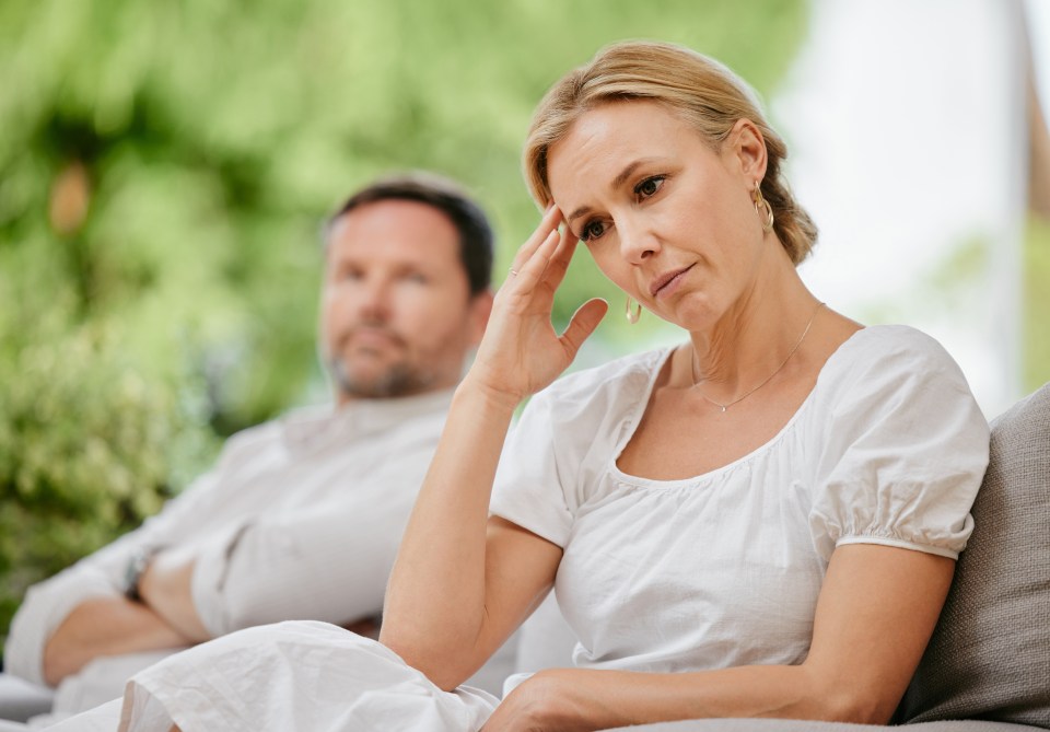 Mature woman looking upset and annoyed after arguing with her husband about marriage problems. Feeling negative. This relationship could end in divorce if they continue to disagree and fight.