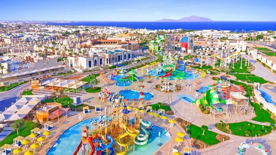 an aerial view of a water park with slides and pools