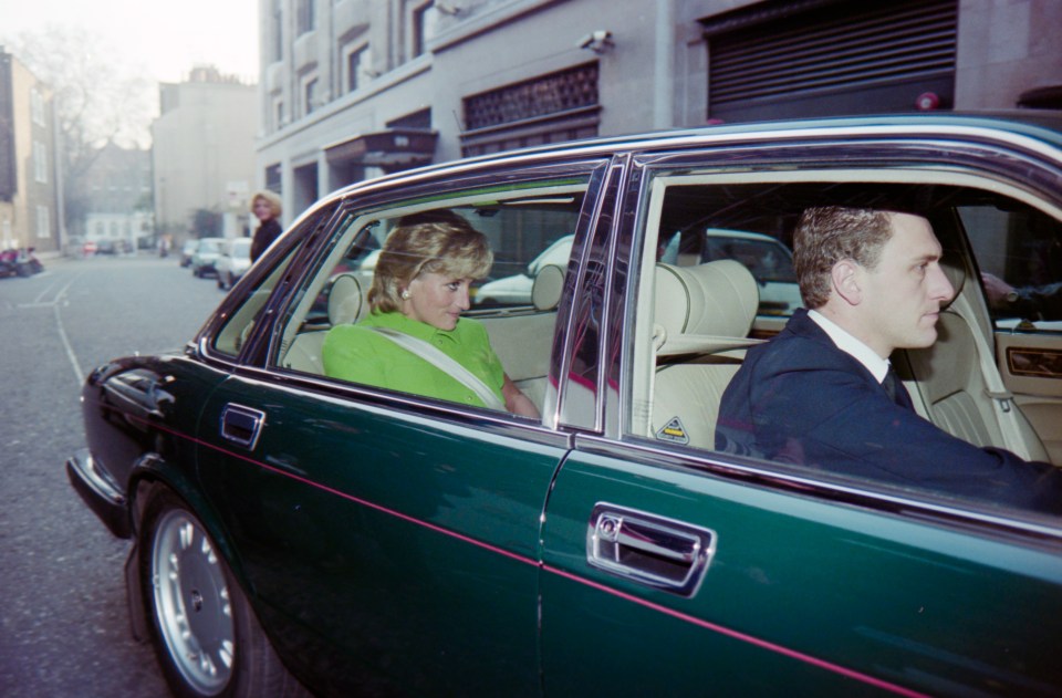 a woman in a green dress is sitting in a green car