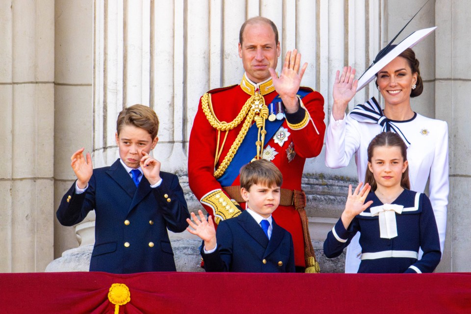 a group of people waving their hands in front of a building