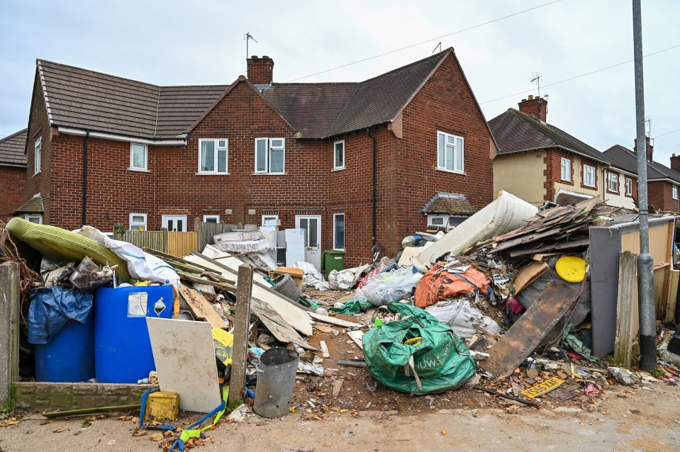 Mr Glover's failure to comply with a notice requiring him to remove the tonnes of waste and restore the garden to its original condition