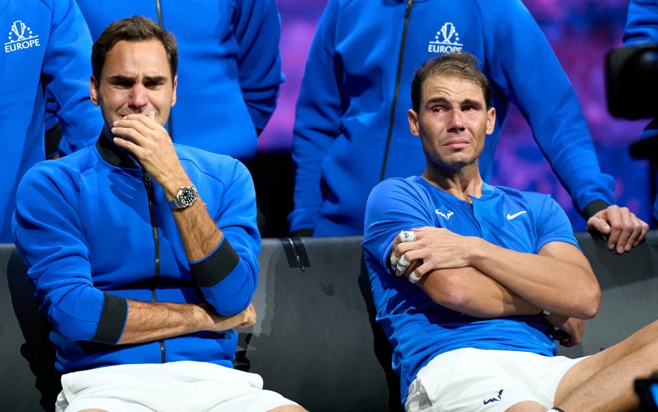 a man in a blue europe shirt sits next to another man