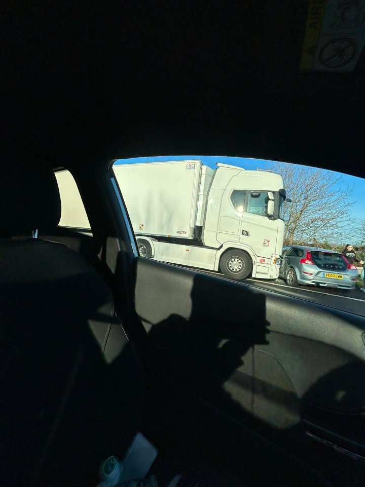 The bus was seen stuck behind a lorry