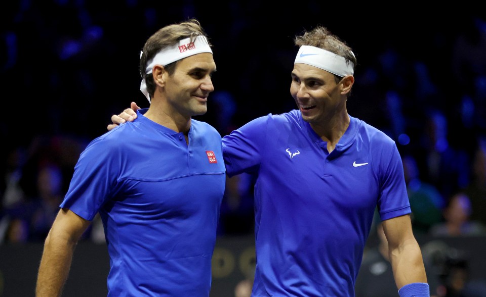 roger federer and rafael nadal are posing for a picture