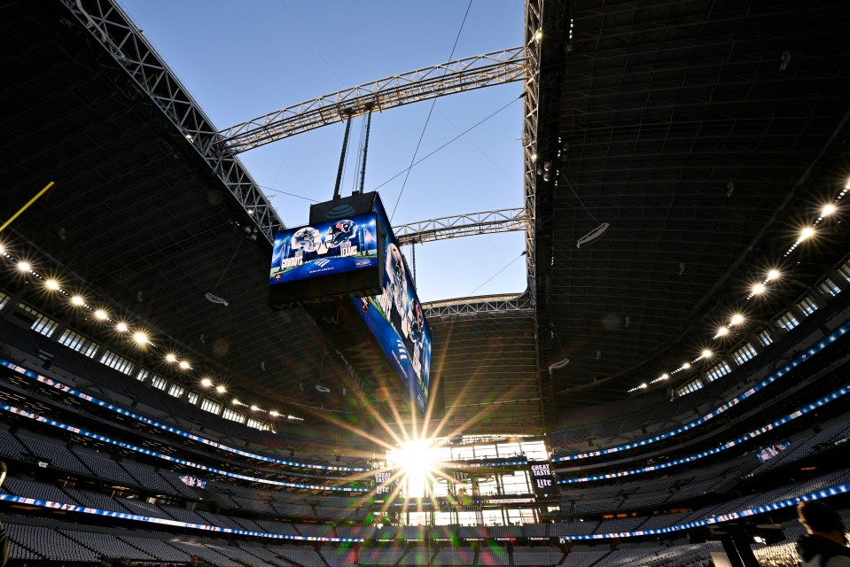 the sun is shining through the ceiling of a stadium