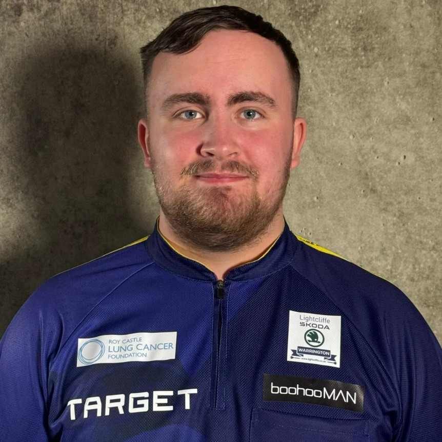 He is wearing an updated darts shirt that features a cancer charity logo