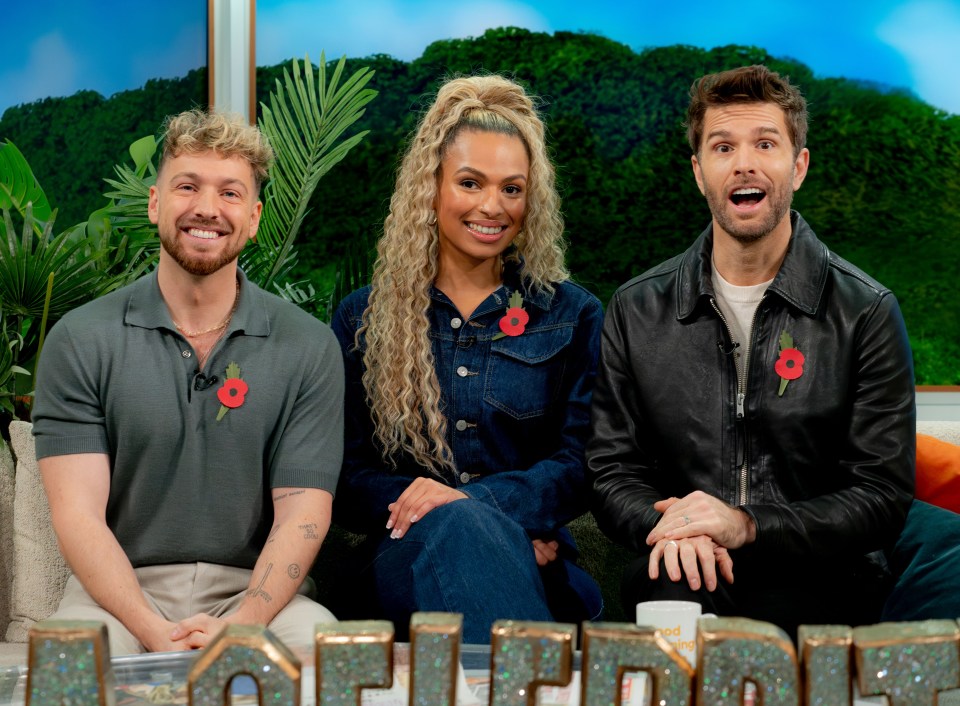 three people sit on a couch in front of a sign that says morning show