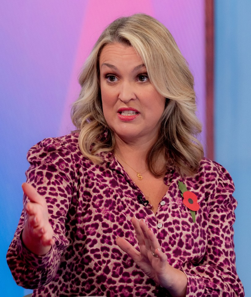 a woman wearing a leopard print shirt with a poppy on it