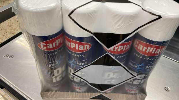 three bottles of carplan are wrapped in plastic