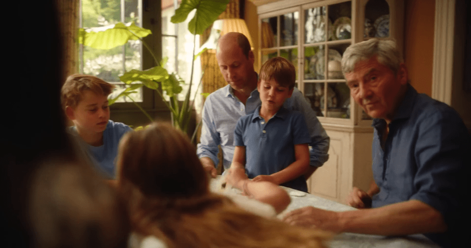 a group of people sitting around a table with plates on it