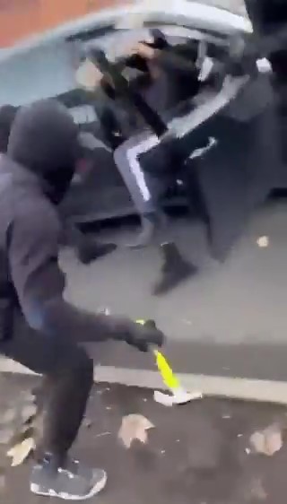 The gang can be seen armed with hammers in the footage