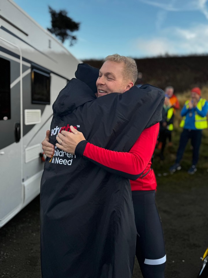 Sir Chris Hoy embraces Paddy on his toughest day during the BBC Children In Need challenge