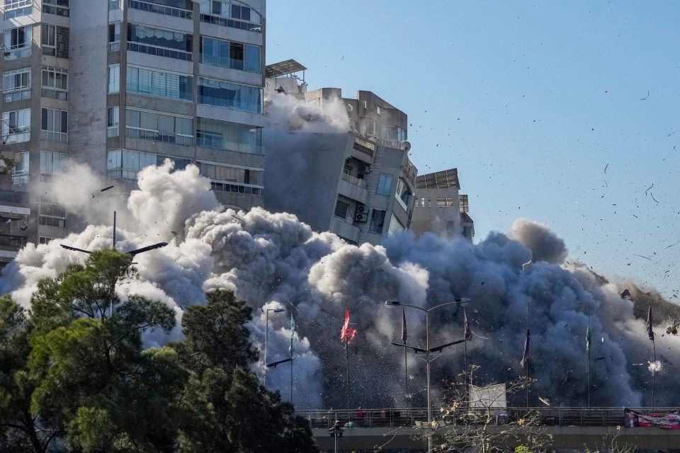 The building crumbled and collapsed in a pile of smoke as Israeli forces claim they targeted Hezbollah 'facilities and interests'