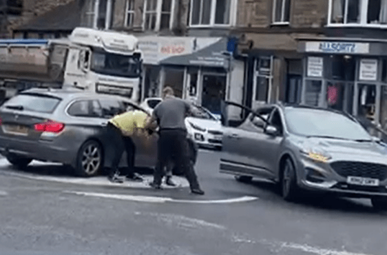 Punches were thrown as the two cars were parked up on a roundabout