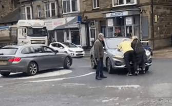 As one driver tried to leave the scene, the BMW driver is seen trying to block his way