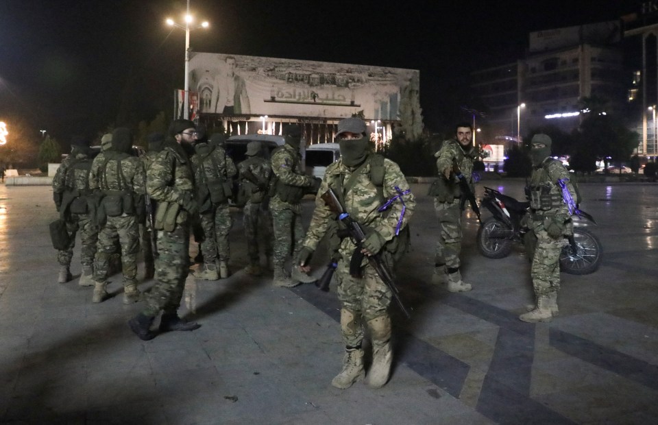 Syrian opposition fighters gather after rebels stormed into Aleppo