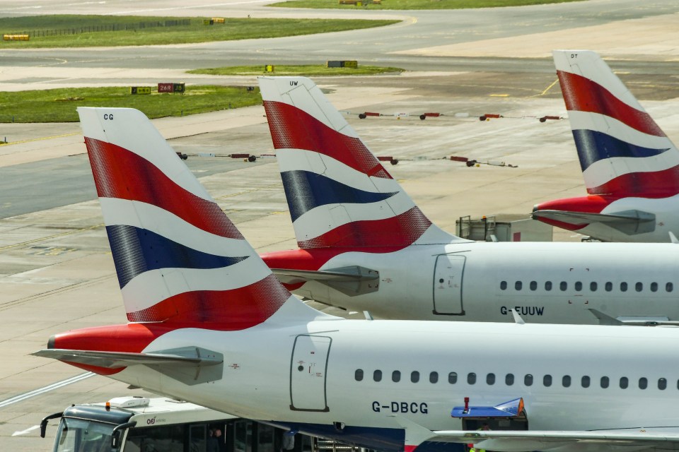 three british airways planes are parked on the tarmac