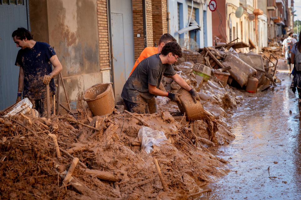 Locals cleaning up now have to contend with tonnes of mud