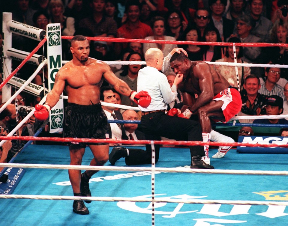 Tyson savouring victory as the referee went to Frank Bruno’s aid after calling a halt to proceedings