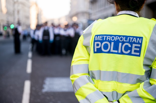 LONDON, ENGLAND - APRIL 19: Extinction Rebellion environmental activists try to stop police from removing their boat on April 19, 2019 in London, England. The boat, called the Berta Caceres, is named after the Honduran environmentalist that was killed in March 2016 by gunmen who broke into her La Esperanza home that had been a focal point of the Oxford Circus occupation since Monday morning. The boat removed from Oxford Circus was then driven down numerous back roads by the police with an escort of over 100 police in an operation estimated to have involved over 1000 police before protesters stopped it for an hour on the corner of Great Portland Street and Langham Street while deciding how to deal with the situation through a mass vote. The boat was lead past the BBC offices to the Energy Institute in Marylebone by protesters where they allowed it to be taken away by Police. The climate change activist group aims to stop traffic and occupy key locations to cause maximum disruption to the capital for up to two weeks unless their climate protection demands are met by the government, as a series of protests take place globally to highlight the ongoing ecological and climate crisis. (Photo by Ollie Millington/Getty Images)