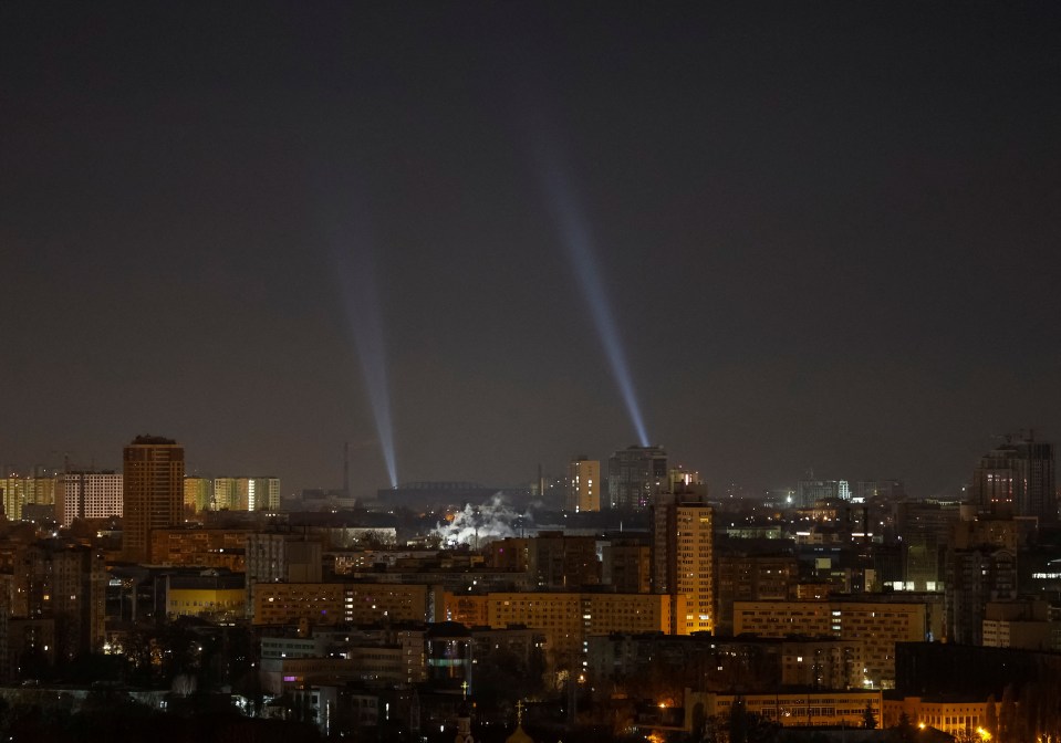 Ukraine use searchlights to spy drones in the sky over the city during a Russian drone strike