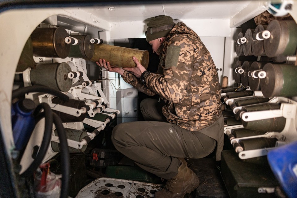 Ukrainian soldier loading artillery shells in the direction of Bakhmut in Donetsk Oblast, Ukraine