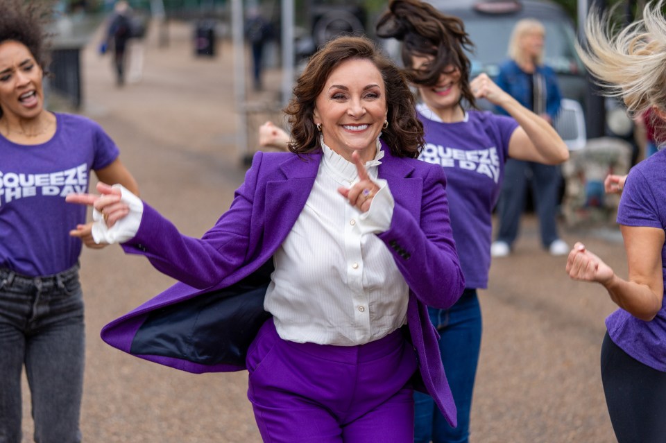 a group of women wearing purple shirts that say squeeze the day