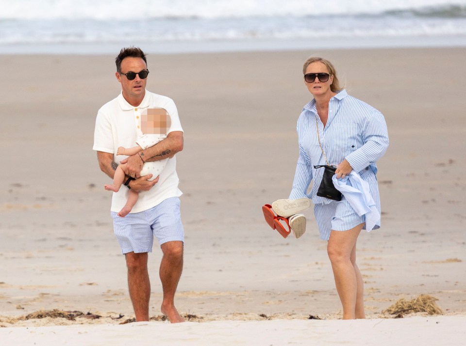 The parent of one held little Wilder, six months, close to his chest as he enjoyed a stroll with wife Anne Marie Corbett