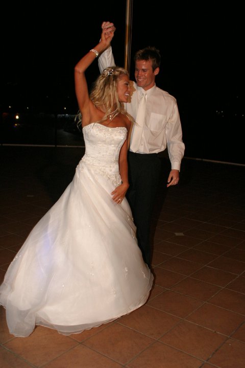 The couple dancing after getting married