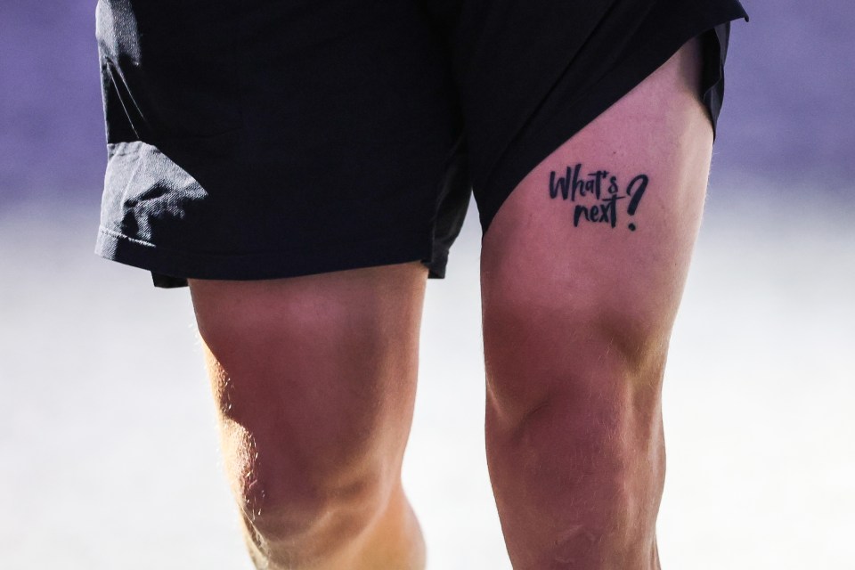 a person has a tattoo on their leg that says what 's next