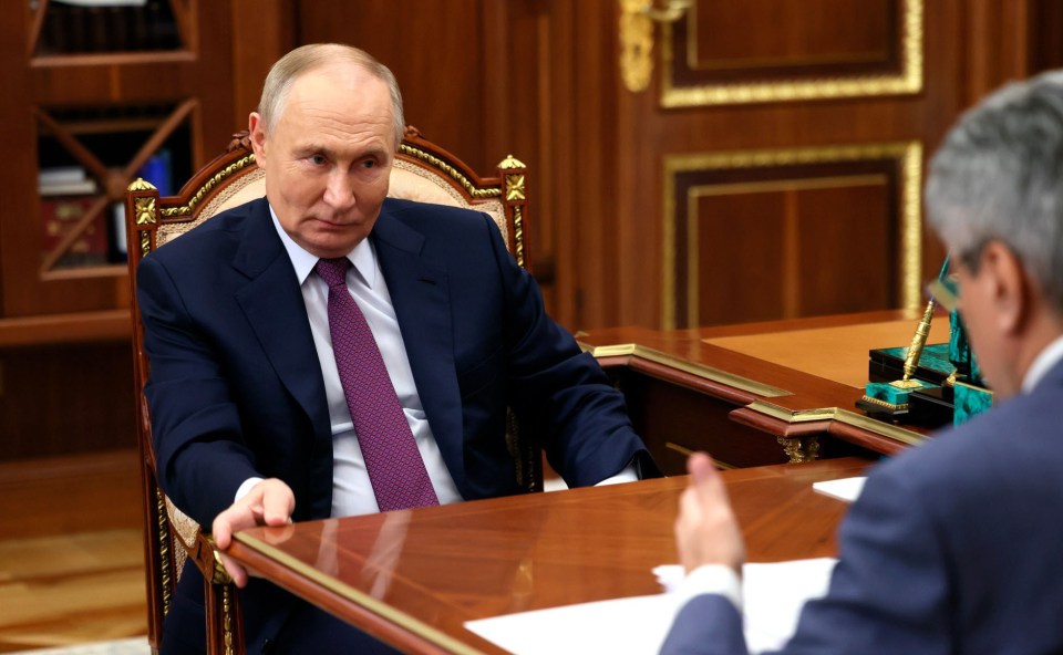 Putin pictured meeting Alexei Nechayev last week where even then he was holding onto the table