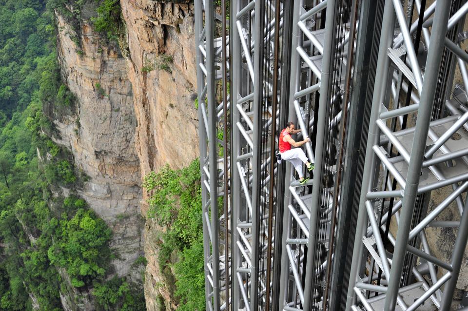 French climber Jean-Michel Casanova climbs the Bailong Elevator