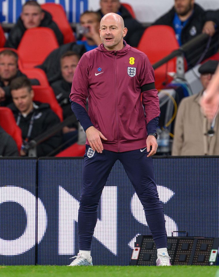 a man wearing a maroon jacket with the number 8 on it