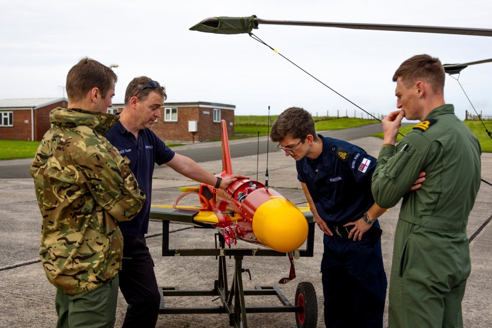 Crew inspect the Banshee drone