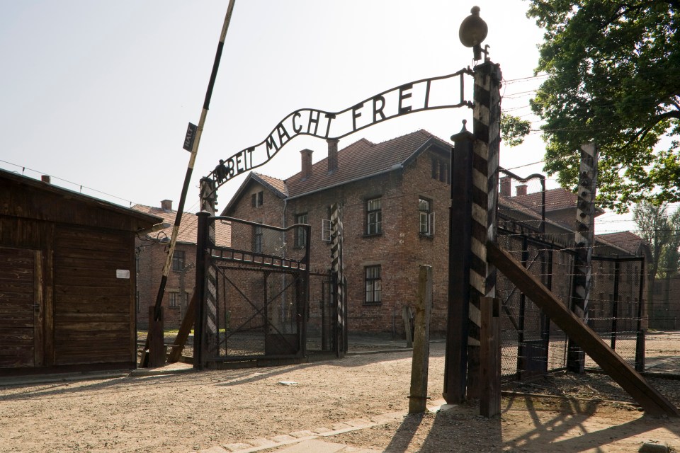 a gate with the words " freiheit macht frei " on it