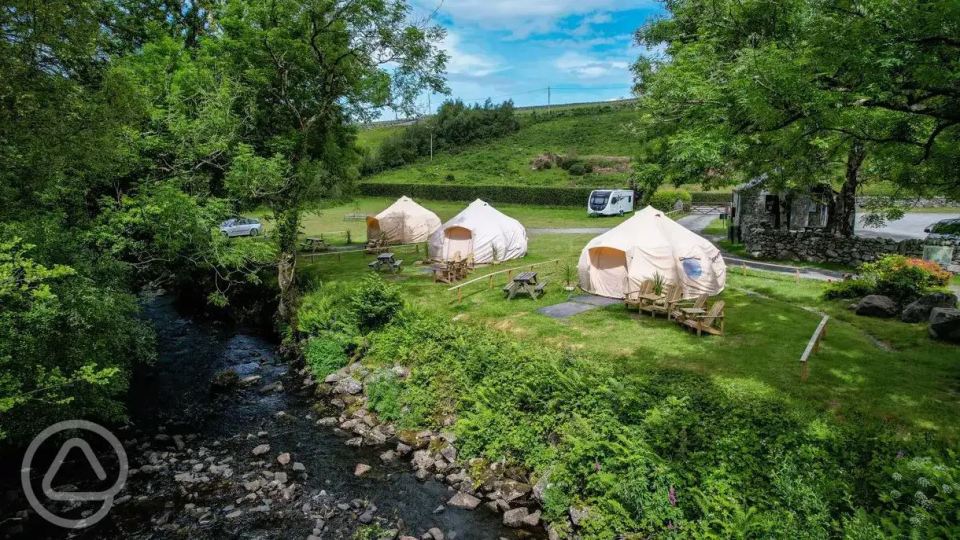 The campsite has a range of accommodation options, such as grass pitches, bell tents and glamping pods